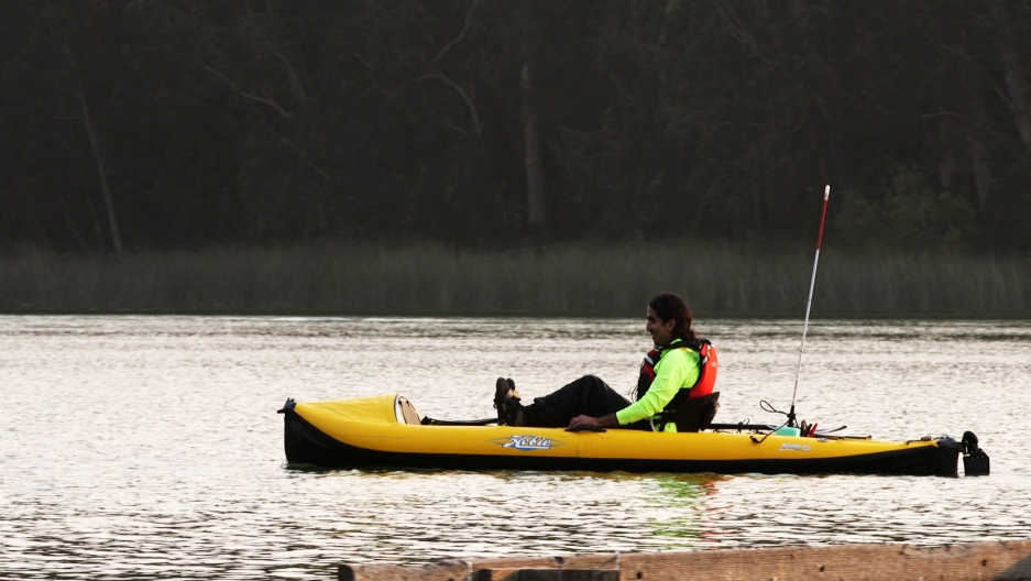 Ahmet Ustunel, who is blind, paddles his kayak solo on San Francisco’s Lake Merced. His goal is to kayak across the Bosphorus Strait in Turkey, his home country.