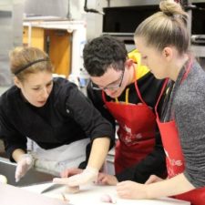 As part of the CarrollPrep weekend program, a young visually impaired teen learns knife cutting skills in a commercial kitchen as he discovers different culinary careers.