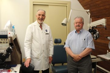 Bob McGillivray and Dr. Richard Jamara stand together in the Low Vision Lab.