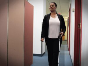 Daniela Depina, a 2019 Carroll Society Award inductee, walks down a hallway to her office at Boston Council for Independent Living.