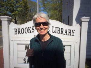 Carla Burke, the 2019 Blind Employee of the Year, smiles outside of the Brooks Free Library in Harwich, MA.