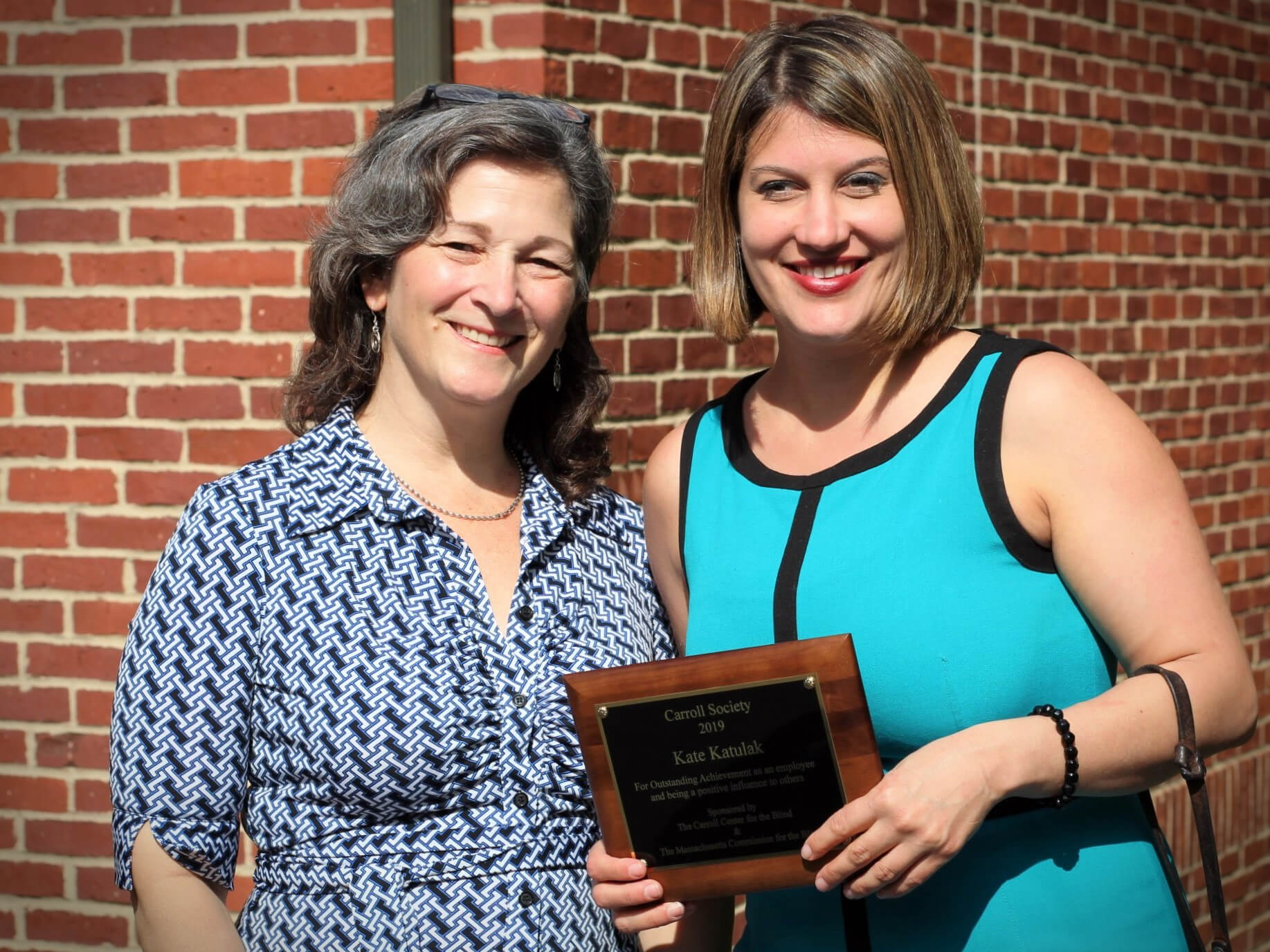 Kate Katulak smiles with her nominating supervisor at the 2019 Carroll Society Awards she was recognized at.
