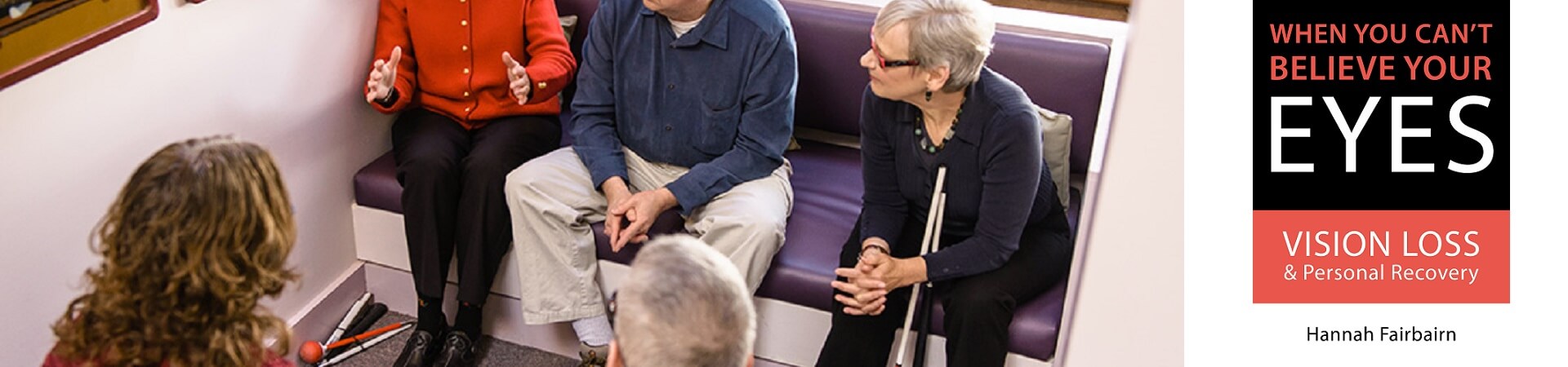 Hannah Fairbairn, author of "When You Can't Believe Your Eyes," sits with a group of four adults with vision loss at the Carroll Center.
