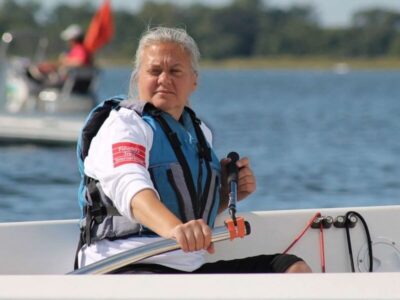 Pauline Dowell steers a sailboat.
