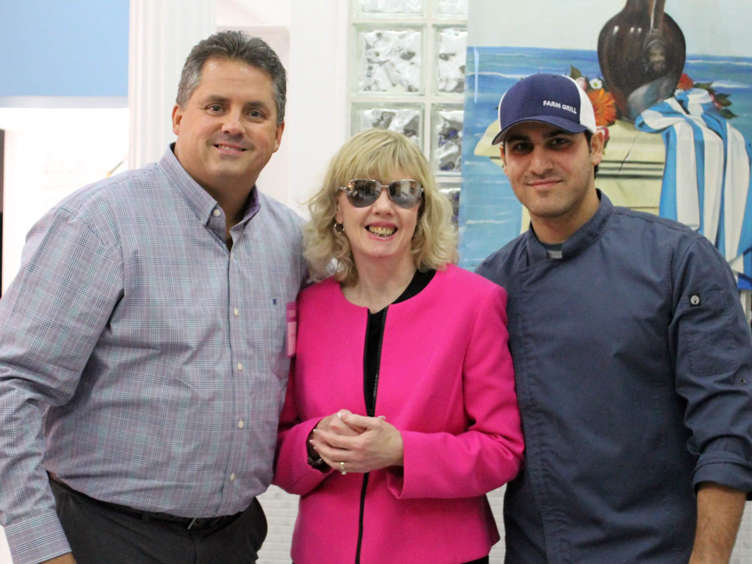 From left to right; Gregory J. Donnelly, President and CEO of the Carroll Center for the Blind; Maura Mazzocca, Personal Management Instructor at the Carroll Center for the Blind; Alex Iliades, Owner of Farm Grill & Rotisserie.
