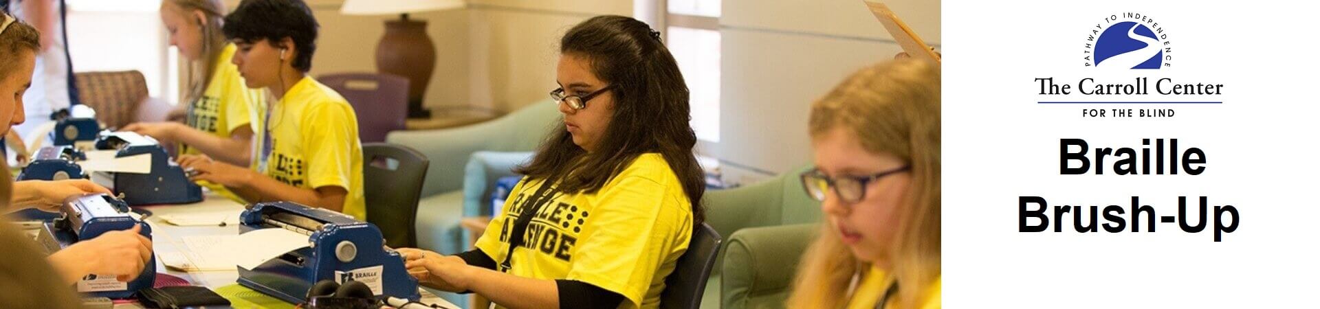 A group of five students wearing yellow "Braille Challenge" shirts practice on their braillers.