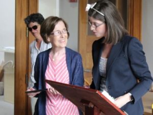 Arlene Anderson, center, now legally blind, receives recognition after completing a class at the Carroll Center for the Blind in Newton.