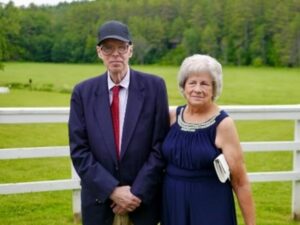 Two donors pose together at a farm.