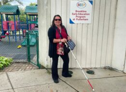 Holly Polgreen stands outside the Brookline Early Education Program at Putterham.