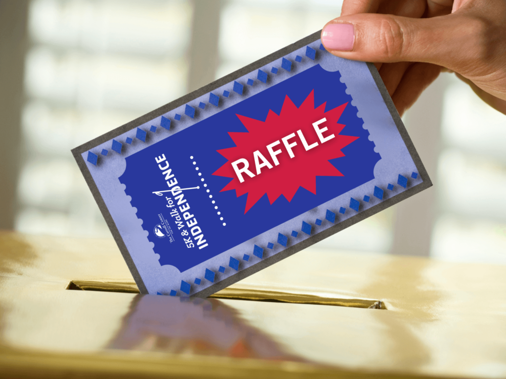 A person places a blue walk for independence raffle ticket into a box.