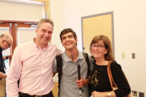 Nico with his father, Robb, and his grandmother, Maryellen, at the Carroll Center for the Blind Talent Show.