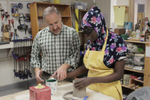 Carroll Center sensory arts instructor during a pottery lesson with a client