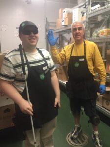 Zach is pictured working at Whole Foods with one of his favorite co-workers, Steve.