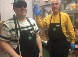 Zach is pictured working at Whole Foods with one of his favorite co-workers, Steve.