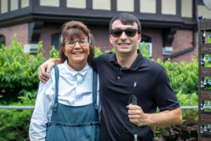 Barbara Duffy with her son, Jack Duffy, standing outside on the Carroll Center campus and smiling