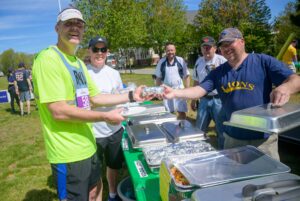 Carroll Center volunteer giving out food for attendees at the Walk for Independence, a yearly fundraising event.
