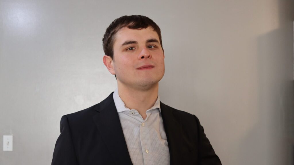 Headshot of Nick Corbett. He is a white man with short brown hair.