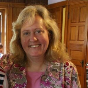 Headshot of instructor Marianne Gilmore. She is a white woman with long blonde hair.